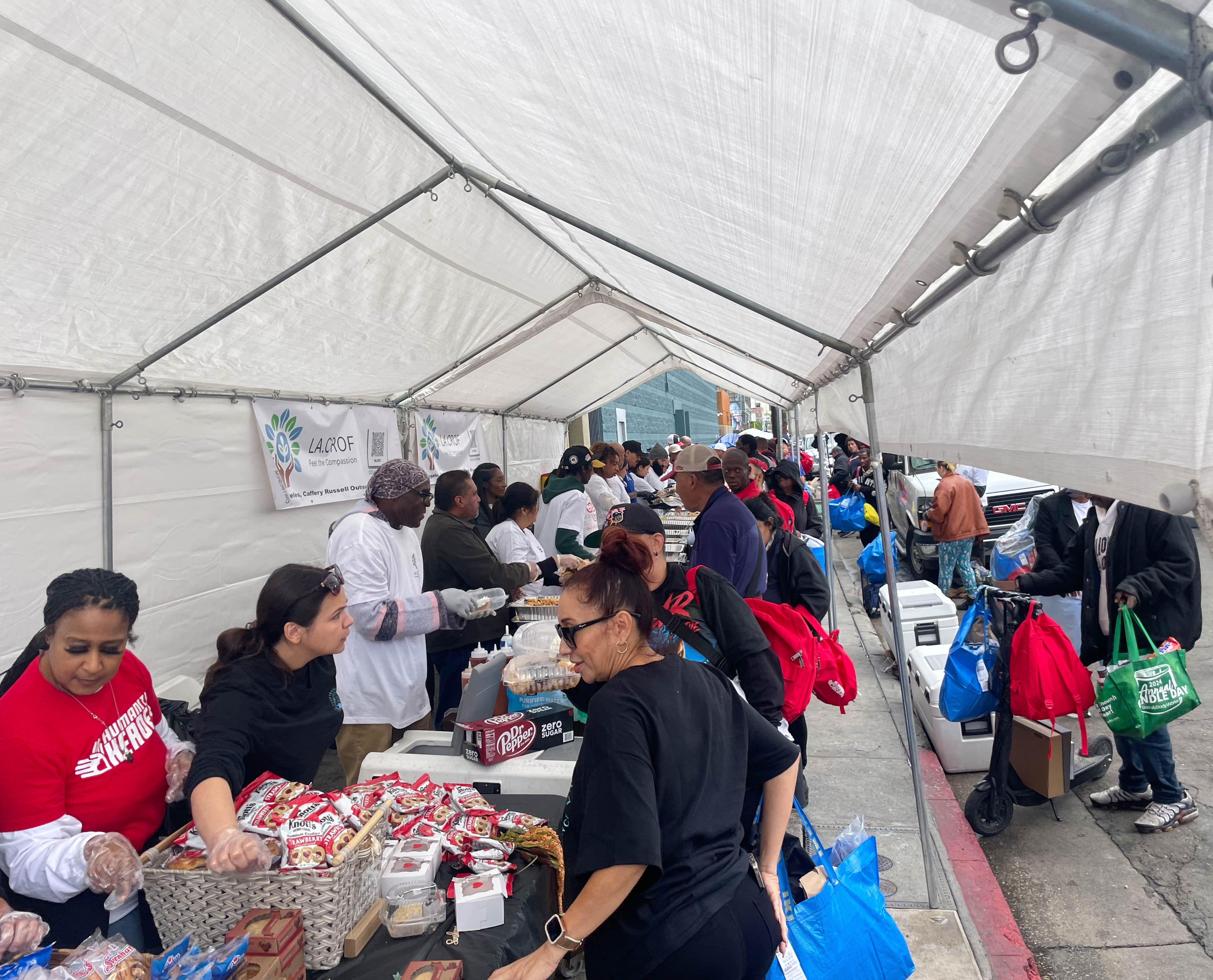 Teen Health team with backpack kits ready for distribution