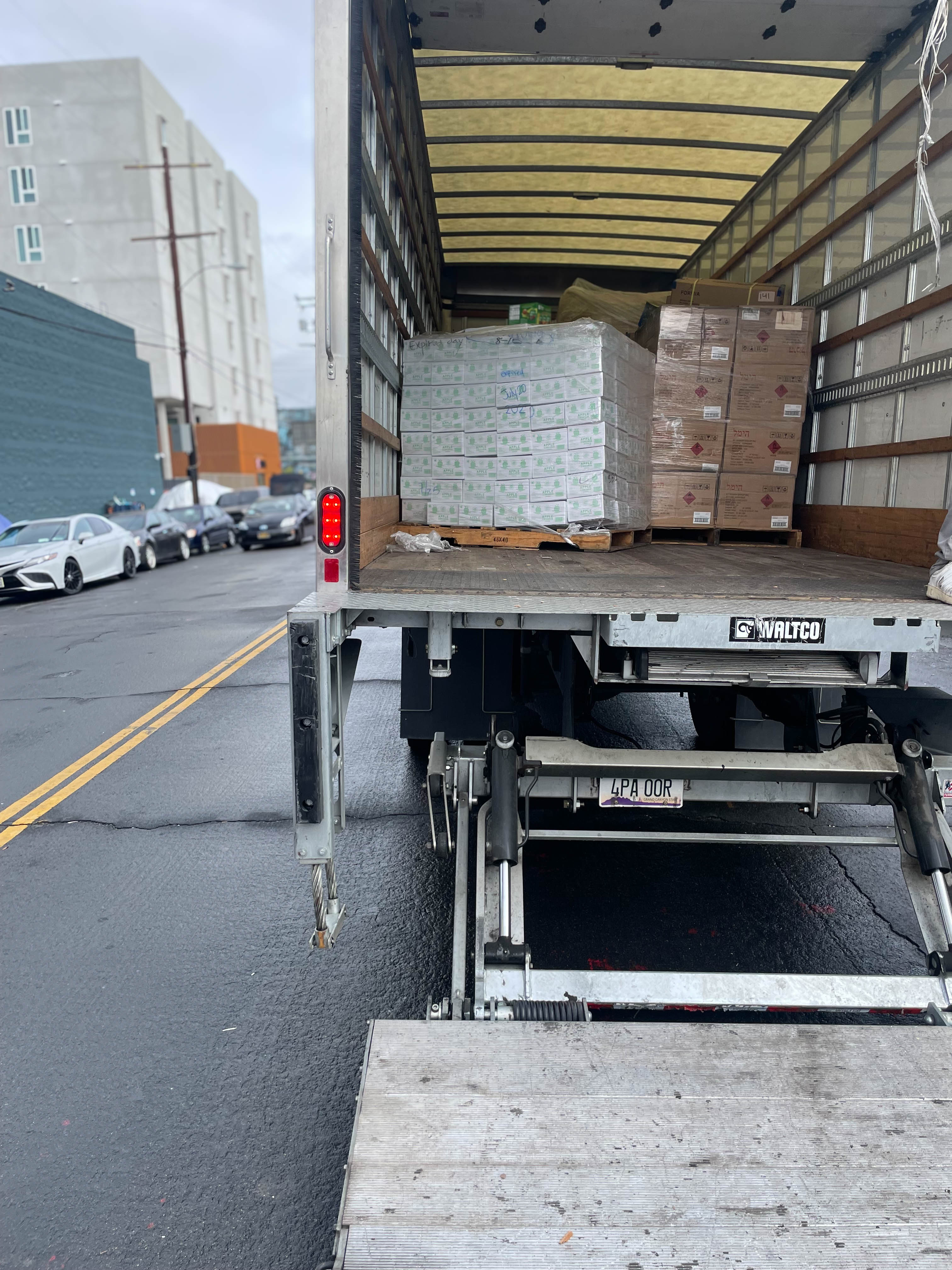 Truck unloading product for distribution